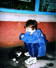 Boy and Cat in an alley in Ukraine