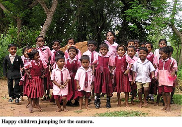 Happy children jumping for the camera.